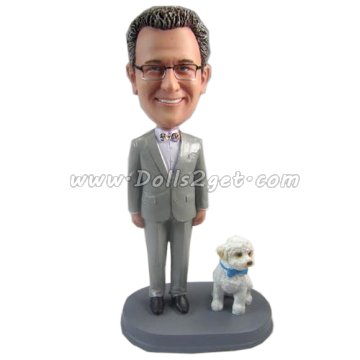 Male and a dog bobblehead doll